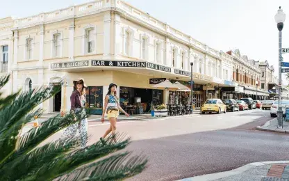 two women crossing the street